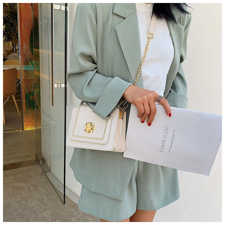 sac a main bandouliere chaine metal dore