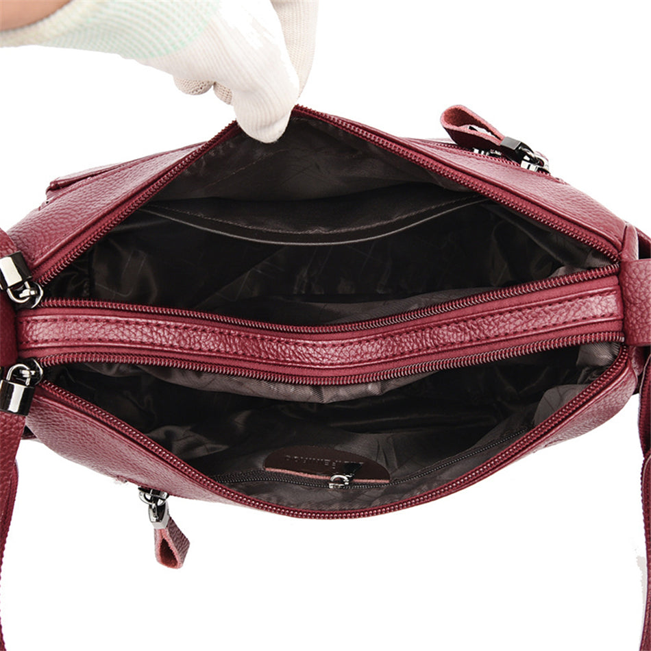 interieur du sac bandouliere bordeaux femme avec poches