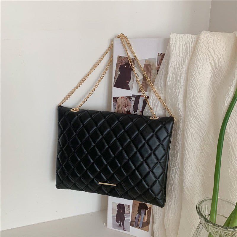 sac a main capitonne noir enveloppe