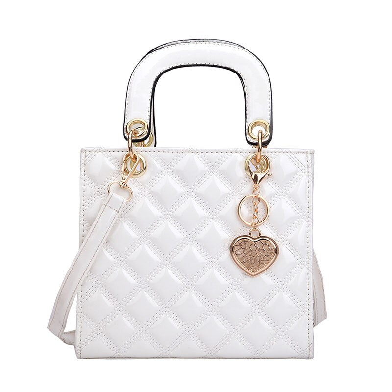 sac a main bandouliere matelasse blanc et details dore