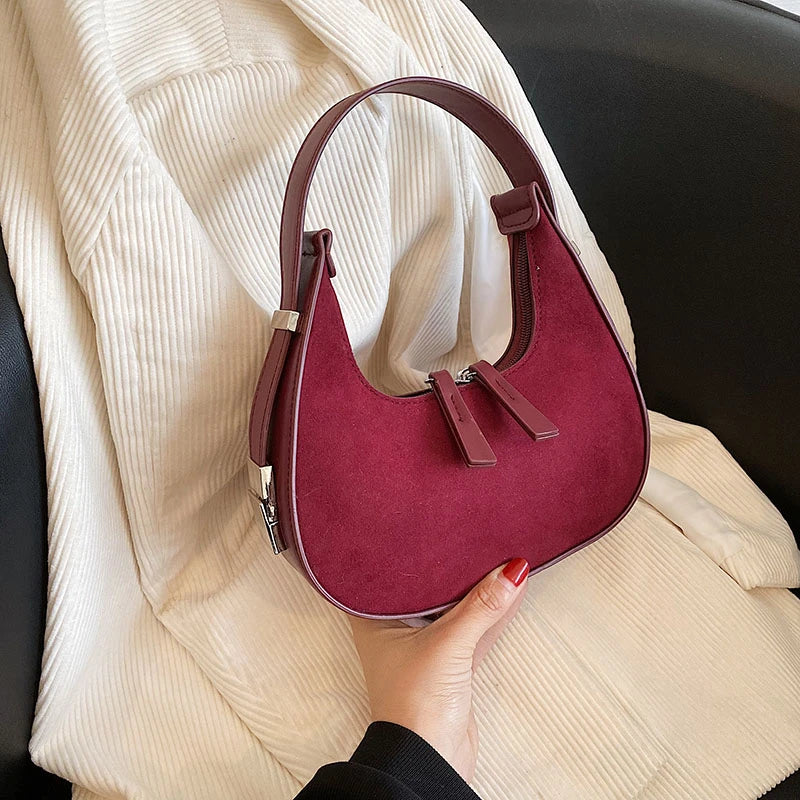 sac a main cuir et daim avec details argentes
