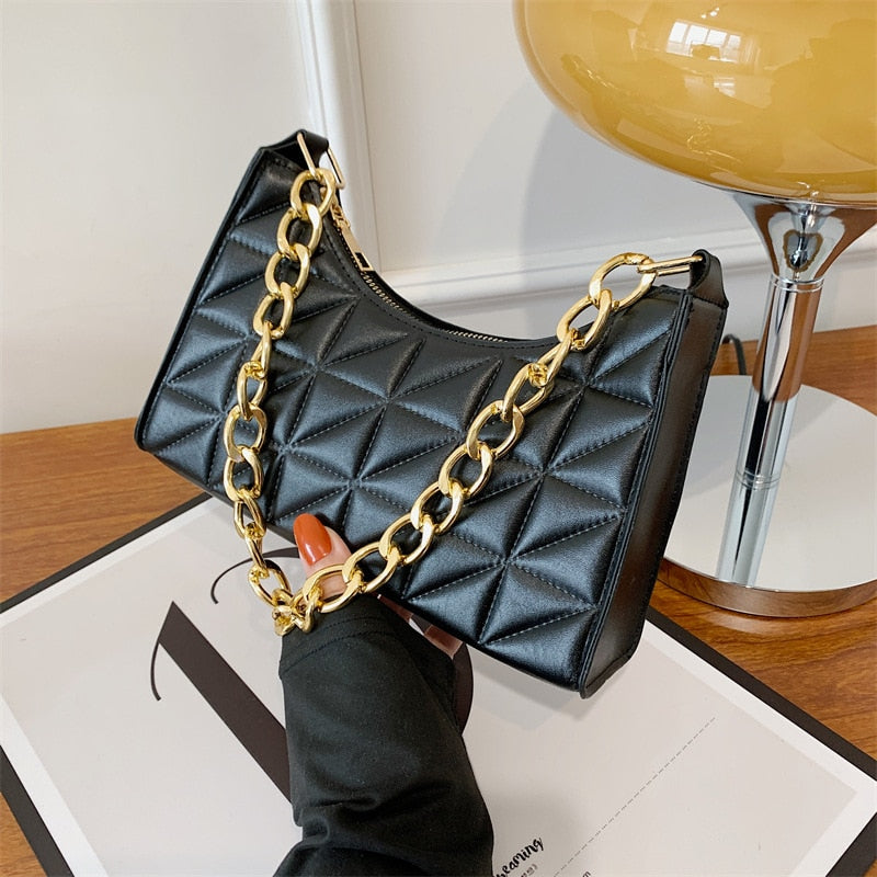 sac a main noir chaine doré branché