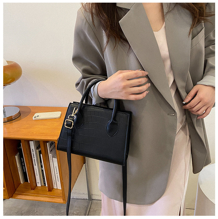sac a main noir petit sophistique