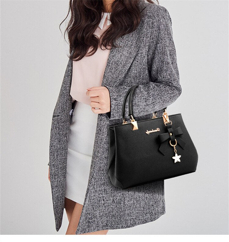 sac a main noir taille moyenne porte main