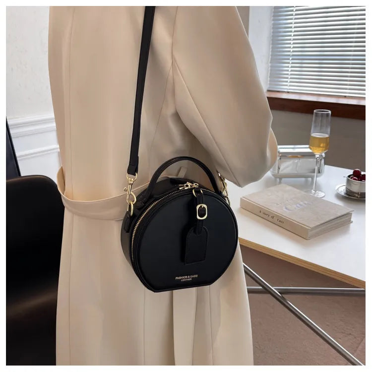 sac bandoulière rond cuir noir