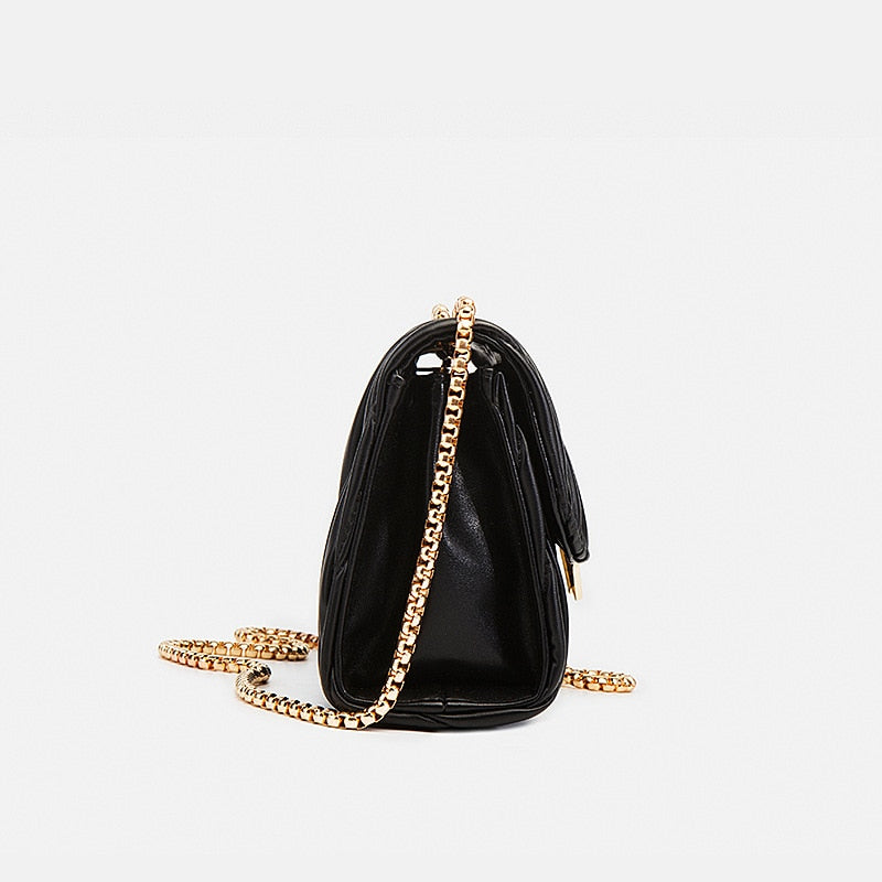 sac bandouliere noir et doré chic