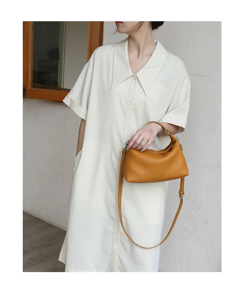 sac bandouliere femme porte a la main