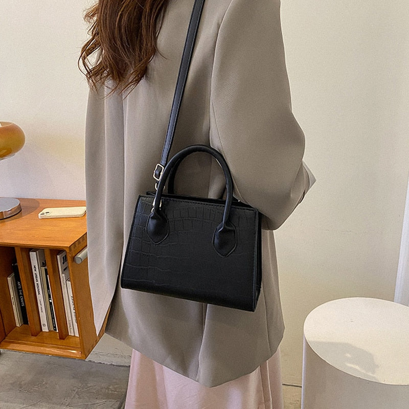 sac a main noir petit porte epaule