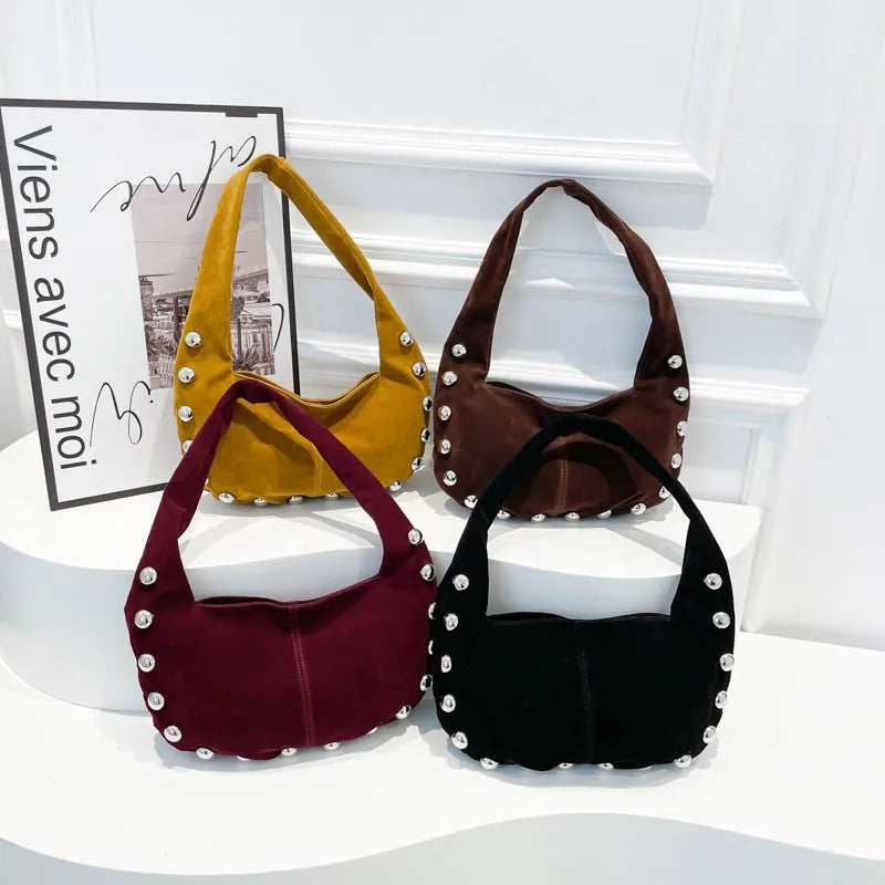 sac en daim femme cloutée