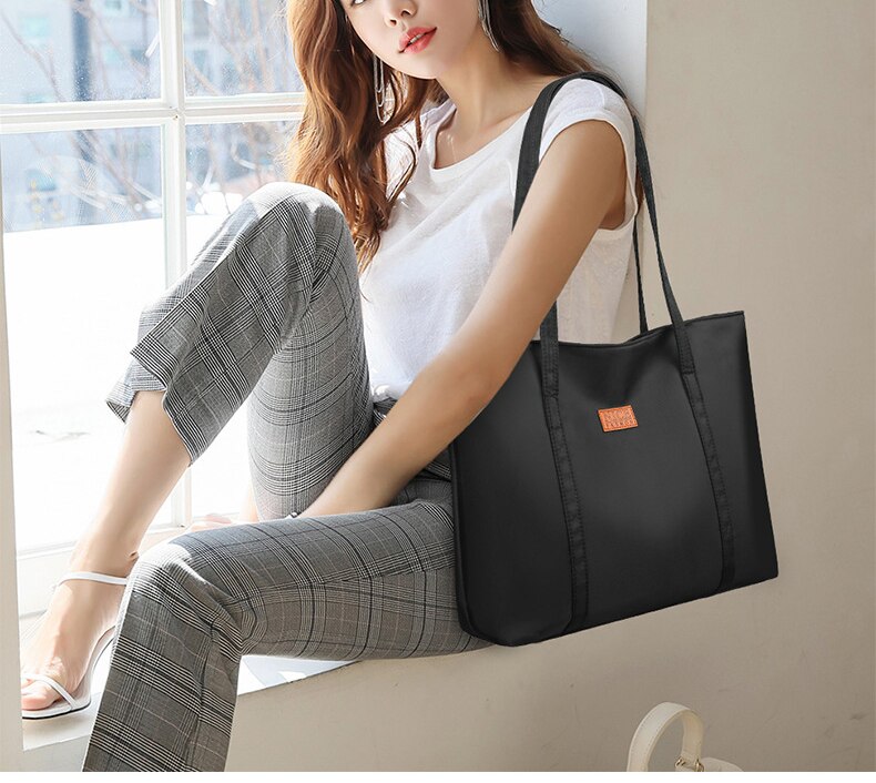 sac a main noir rectangulaire tote bag