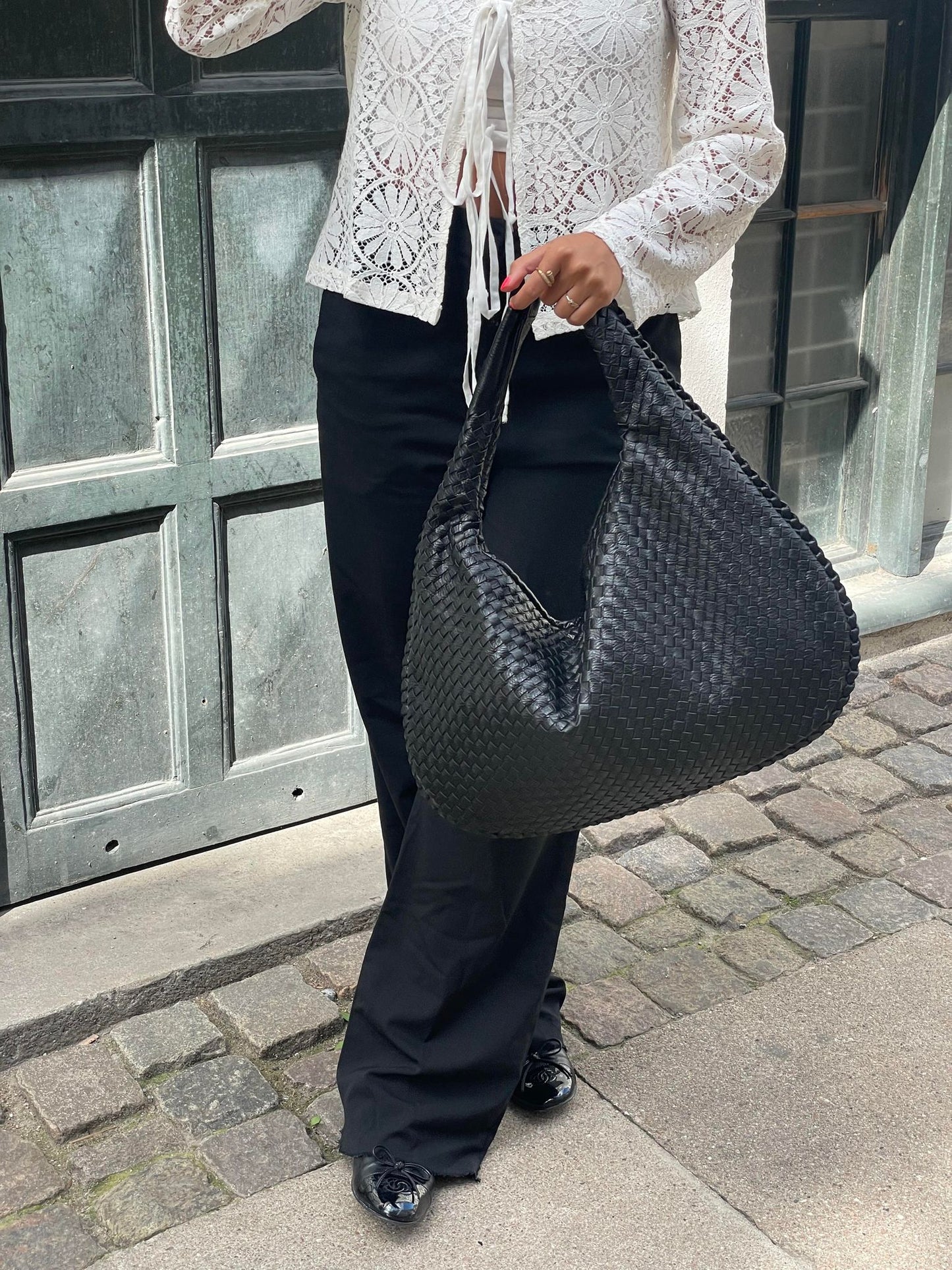 sac à main noir tressé en cuir