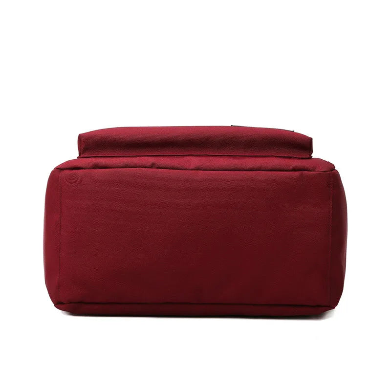 dessous du sac a dos bordeaux
