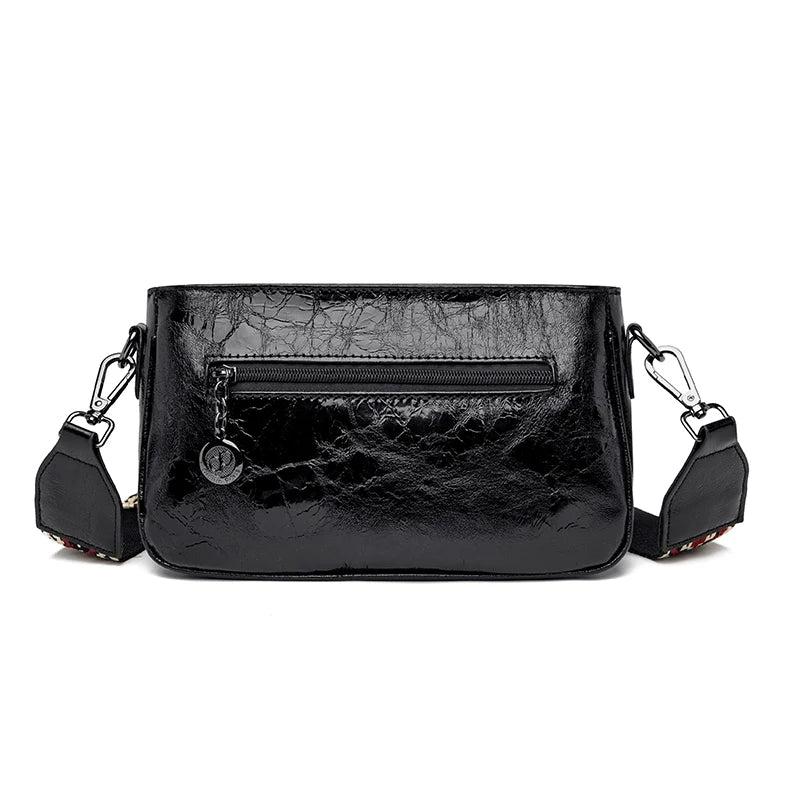 Dos du sac métallisé noir avec sa poche zippée