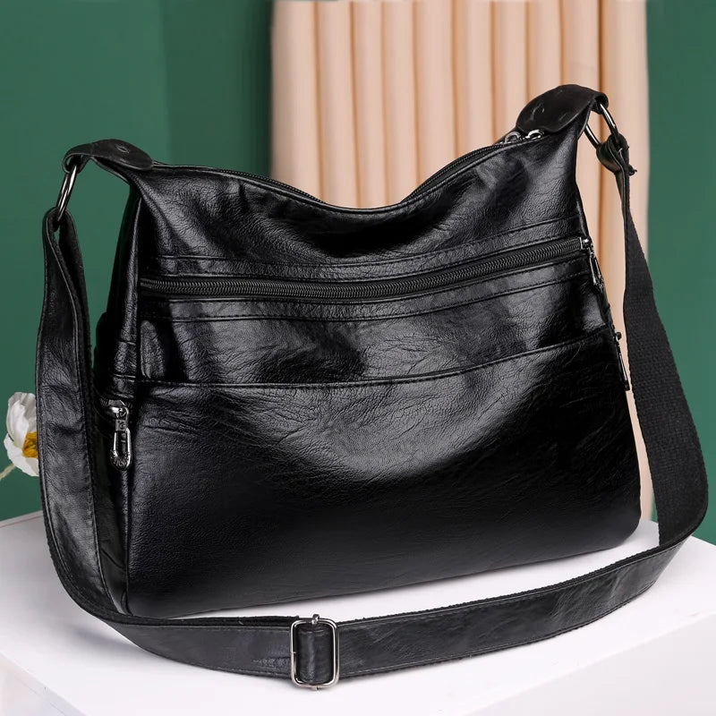 sac besace noir femme en cuir souple